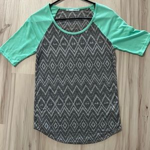 Maurice’s size small geometric pattern with mint/green sleeves.
